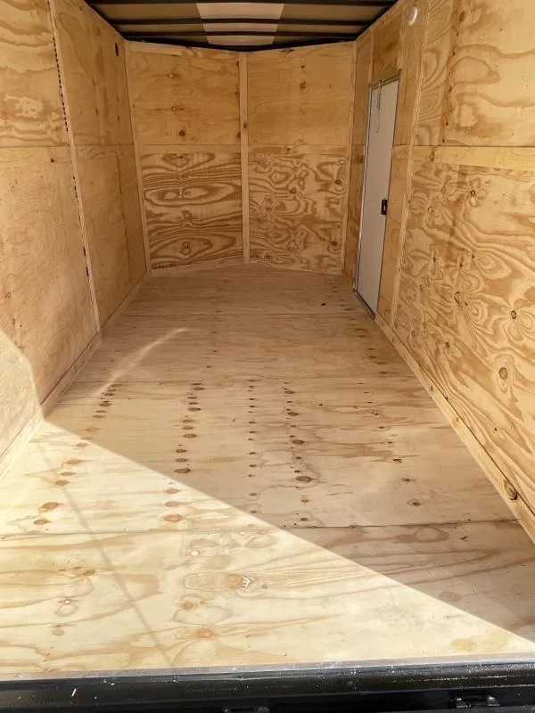 Interior of 6x14 enclosed trailer showing plywood floor and walls