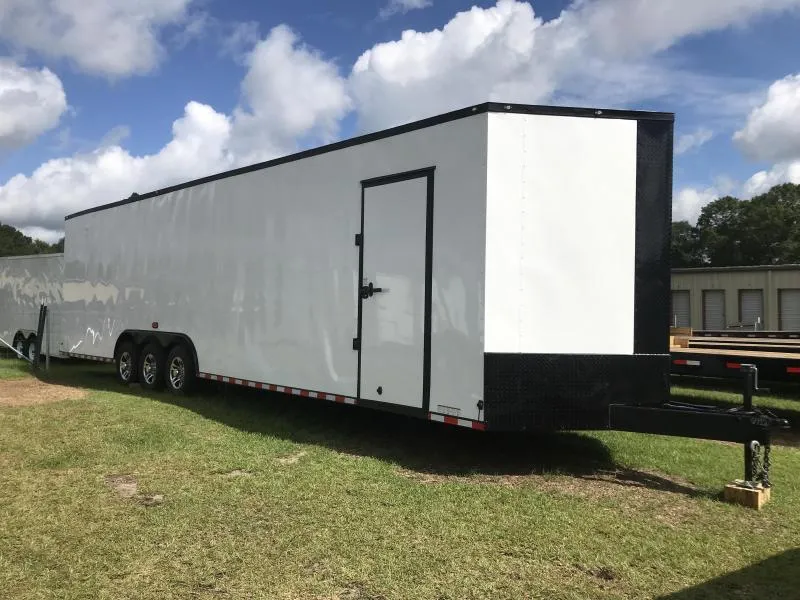 Blackout enclosed trailer with tandem axle and black wheels