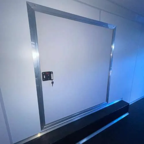 Interior of enclosed car hauler trailer with tie-down points for secure transport