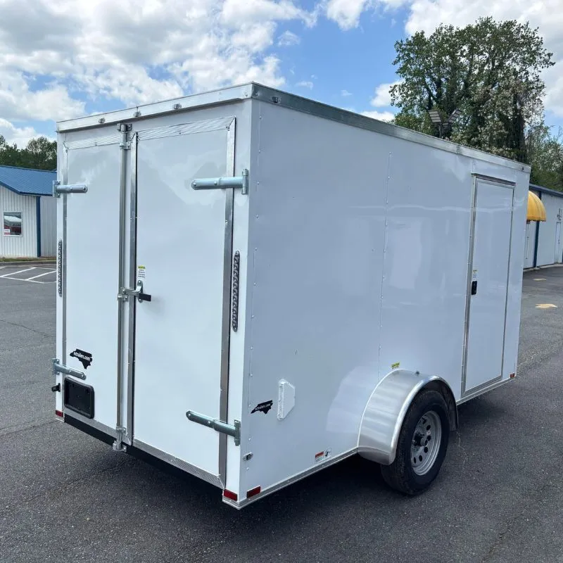 Side profile of a new enclosed trailer with rear barn doors built in Georgia