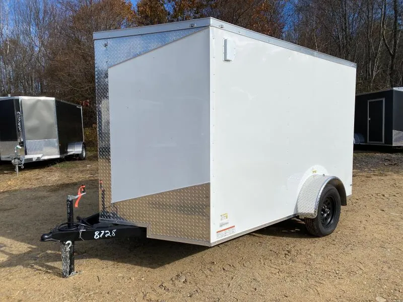 Enclosed trailer with awning deployed creating shaded work area