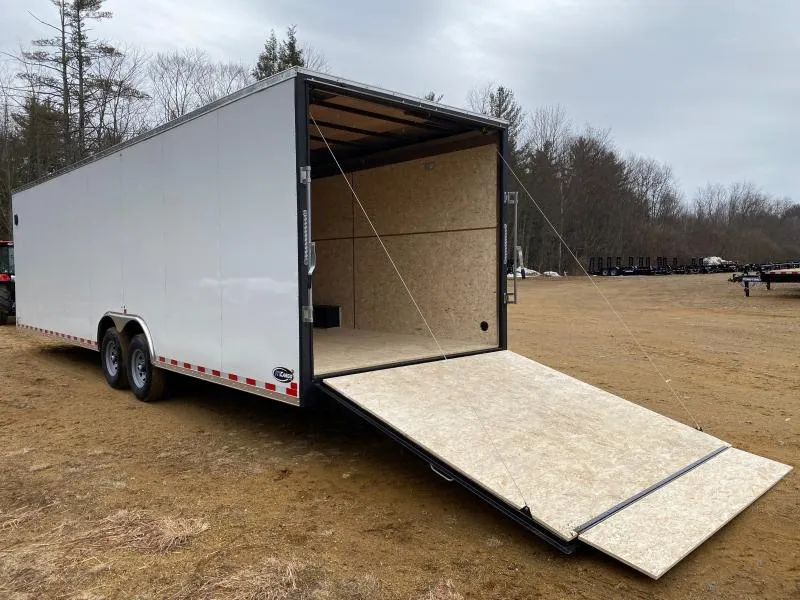 Interior of an enclosed cargo trailer with plywood flooring and walls